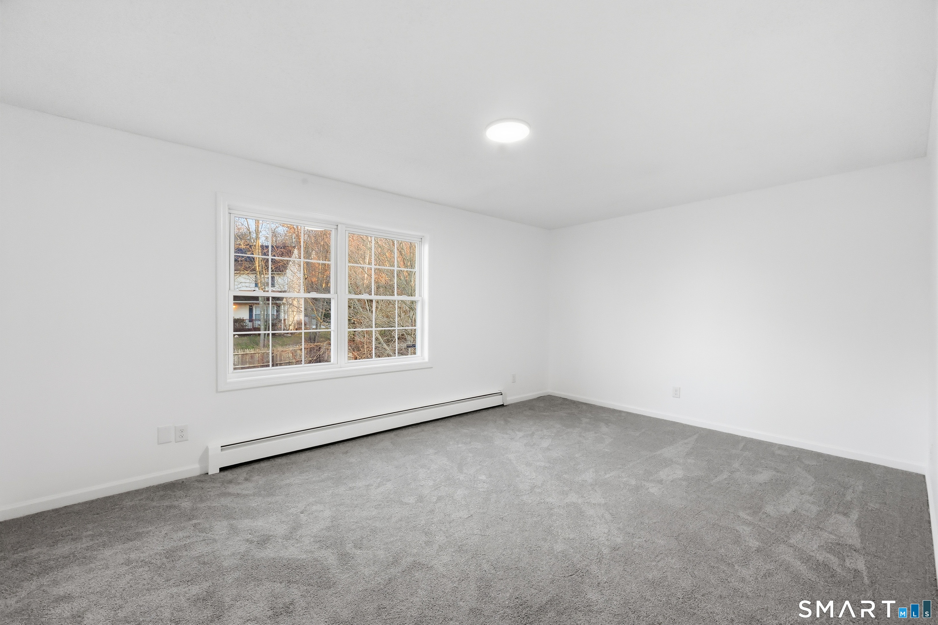 70 Victoria Court Hamden, CT 06514 - Photo 20 of 30 an empty room with a window