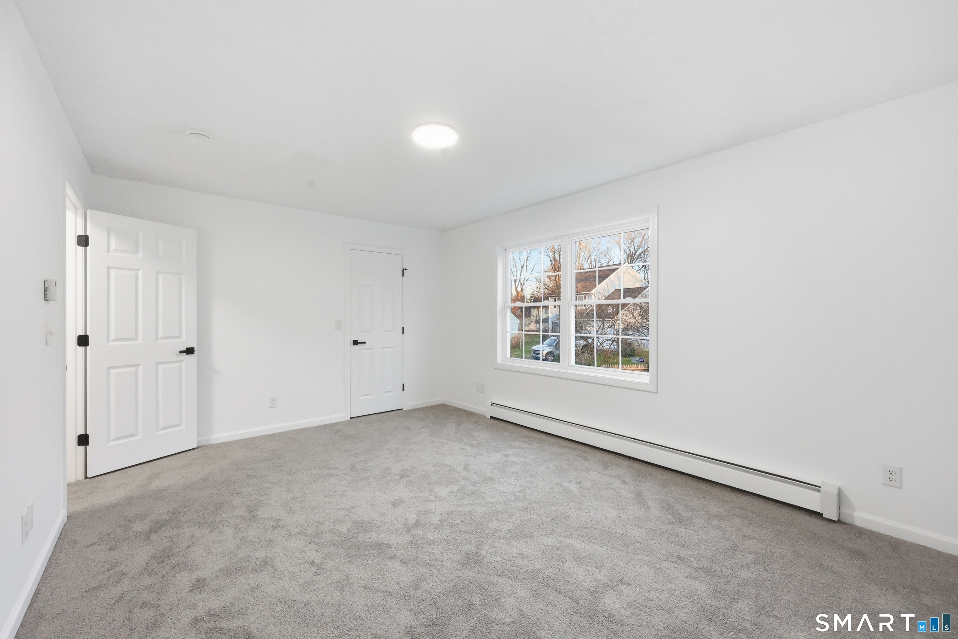 70 Victoria Court Hamden, CT 06514 - Photo 21 of 30 a view of an empty room with a window