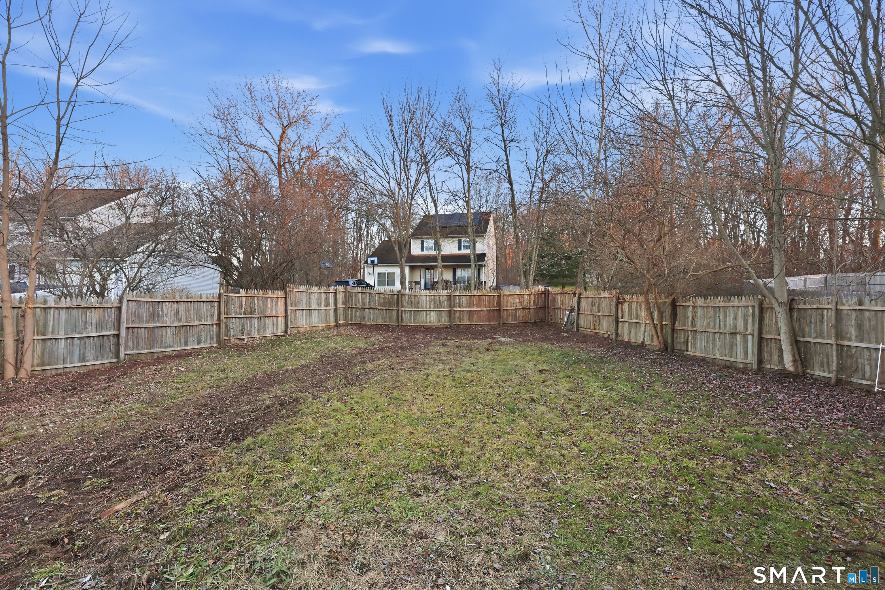 70 Victoria Court Hamden, CT 06514 - Photo 24 of 30 a view of backyard with wooden fence