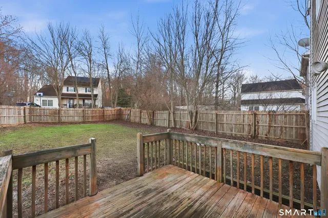 a view of a house with wooden deck