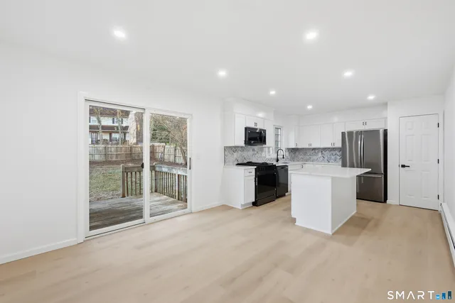 a view of an empty room with glass door