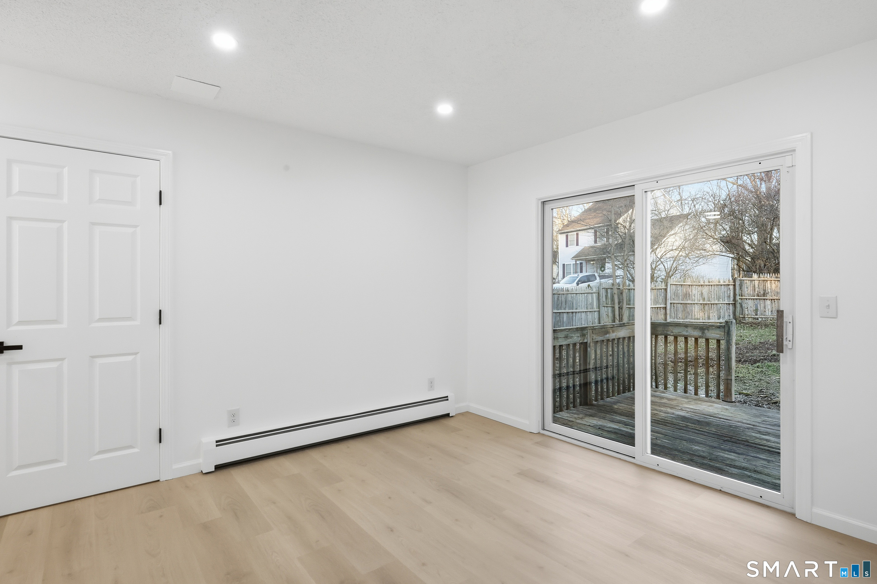 70 Victoria Court Hamden, CT 06514 - Photo 7 of 30 a view of an empty room with glass door