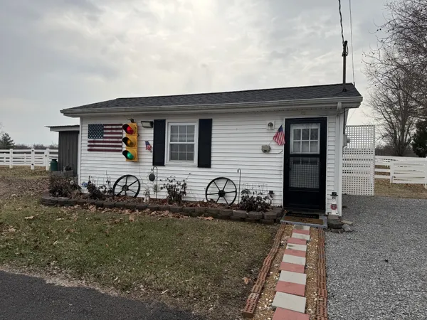 a front view of a house with yard