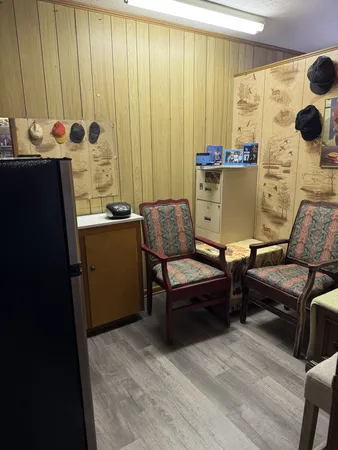 a living room with furniture and lamp