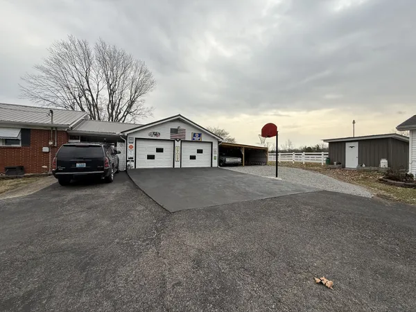 a view of a car park in front of a house