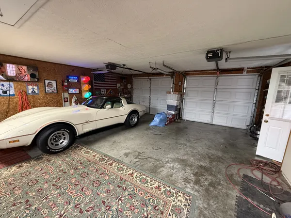 a front view of a house with sitting area