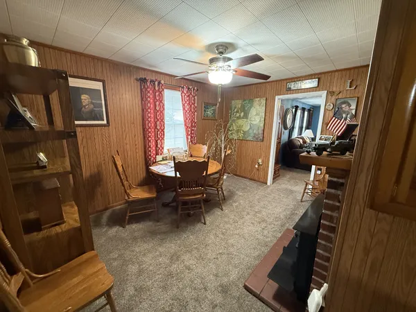 a view of a livingroom with furniture a flat screen tv