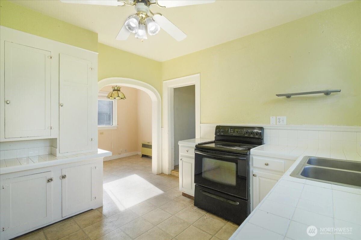 1212 3rd Street Cosmopolis, WA 98537 - Photo 11 of 31 a kitchen with a stove oven and sink