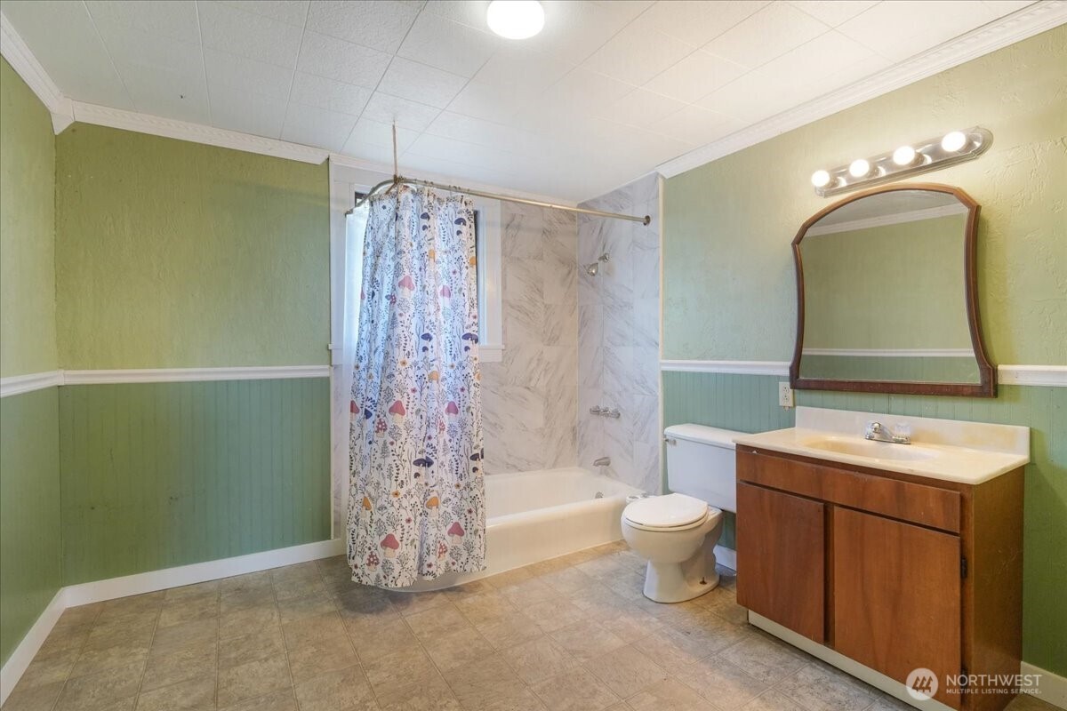 1212 3rd Street Cosmopolis, WA 98537 - Photo 19 of 31 a bathroom with a toilet sink and mirror