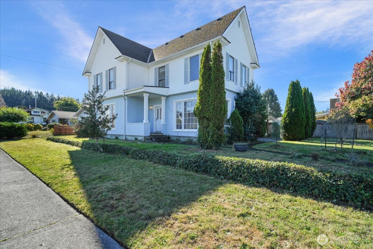 1212 3rd Street Cosmopolis, WA 98537 - Photo 2 of 31 a front view of a house with a yard
