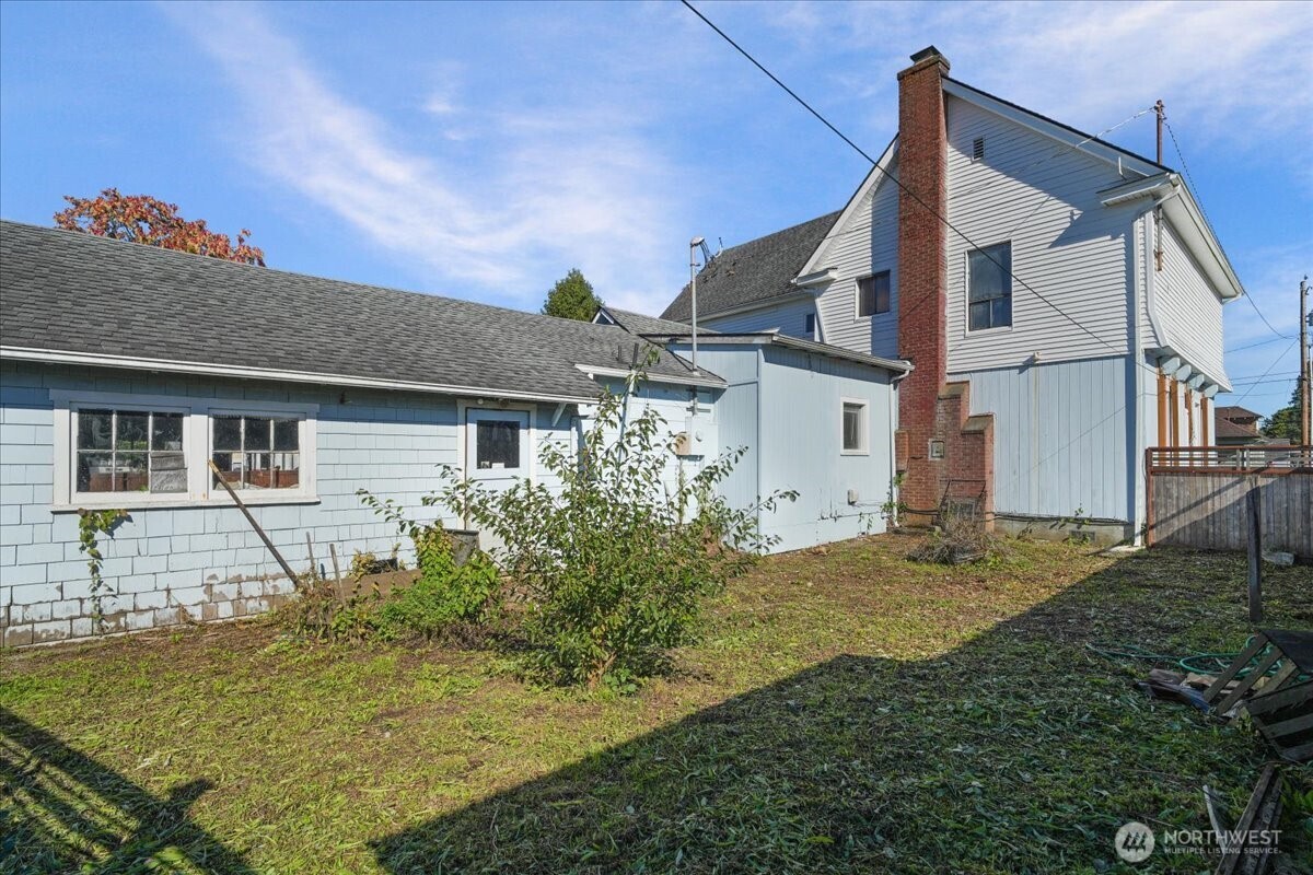 1212 3rd Street Cosmopolis, WA 98537 - Photo 23 of 31 a view of a house with backyard and sitting area