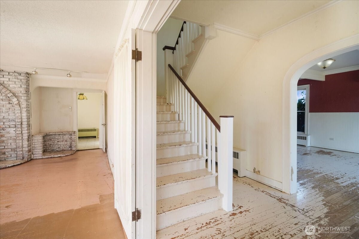 1212 3rd Street Cosmopolis, WA 98537 - Photo 4 of 31 a view of a hallway with wooden floor and entryway