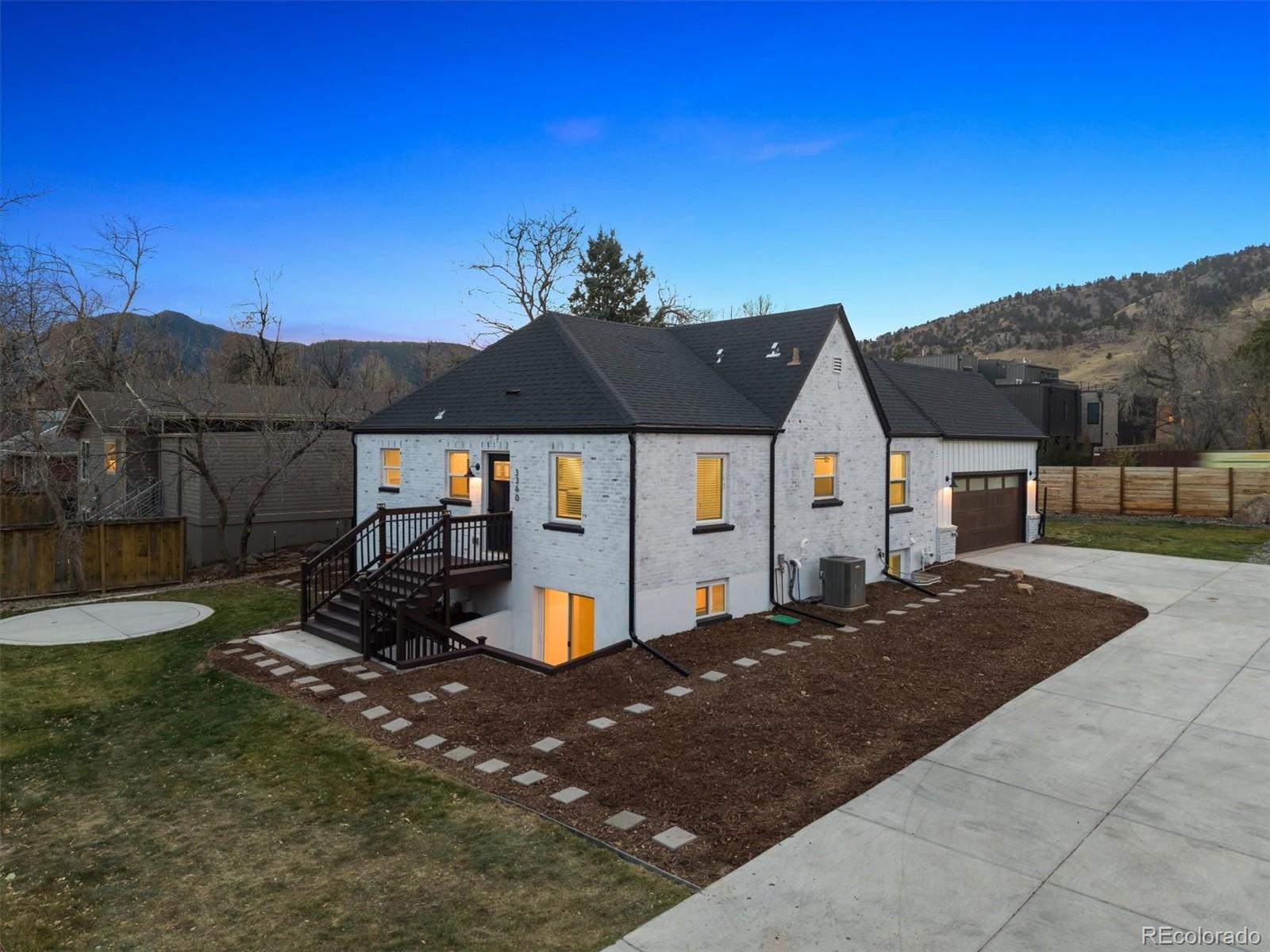 3360 Broadway Boulder, CO 80304 - Photo 1 of 35 a front view of a house with a yard