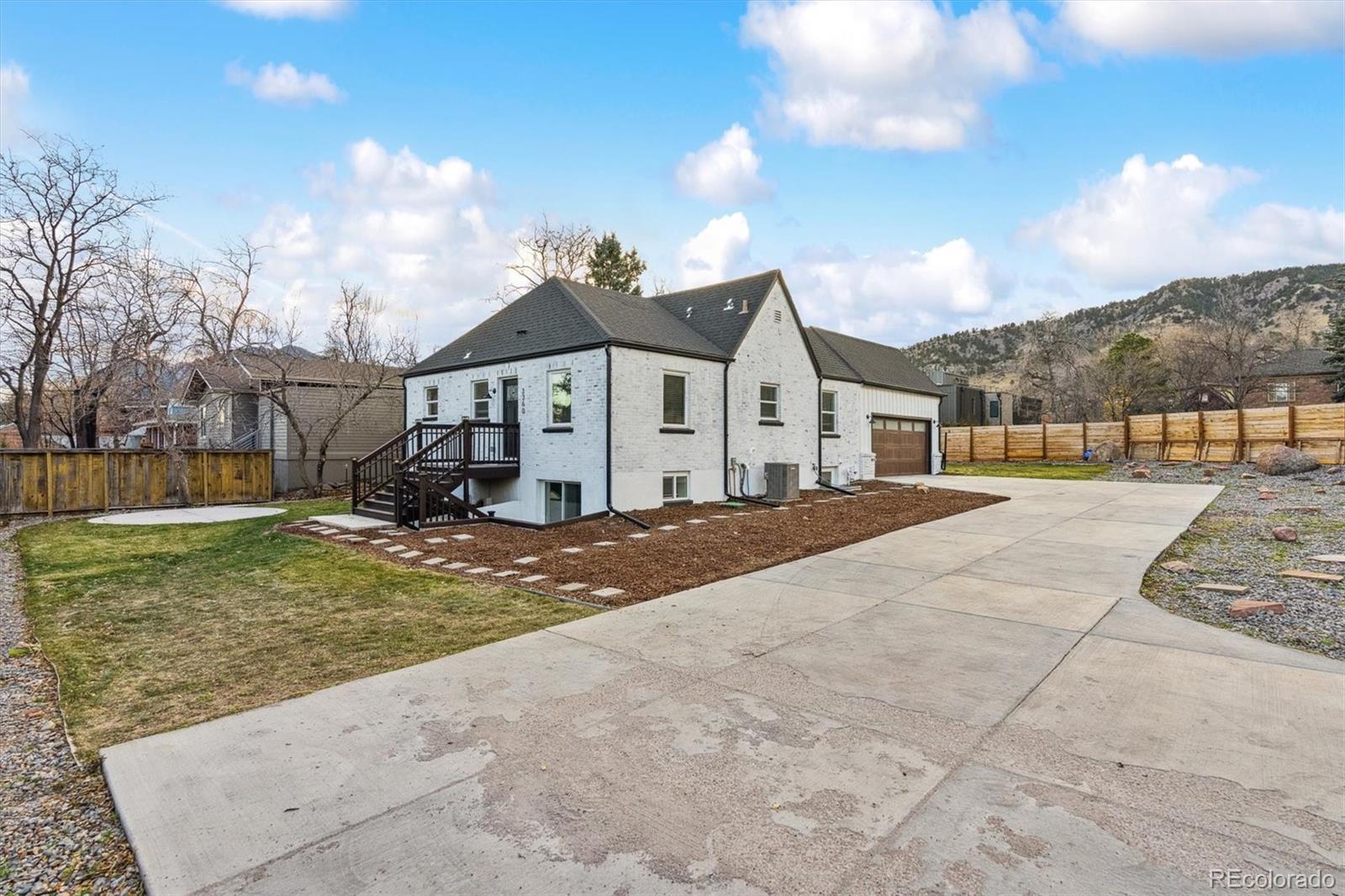 3360 Broadway Boulder, CO 80304 - Photo 20 of 35 a view of a white house with a yard