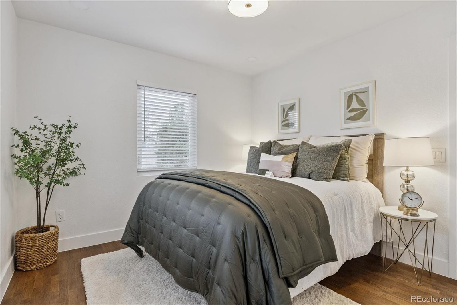 3360 Broadway Boulder, CO 80304 - Photo 9 of 35 a bedroom with a bed and a potted plant