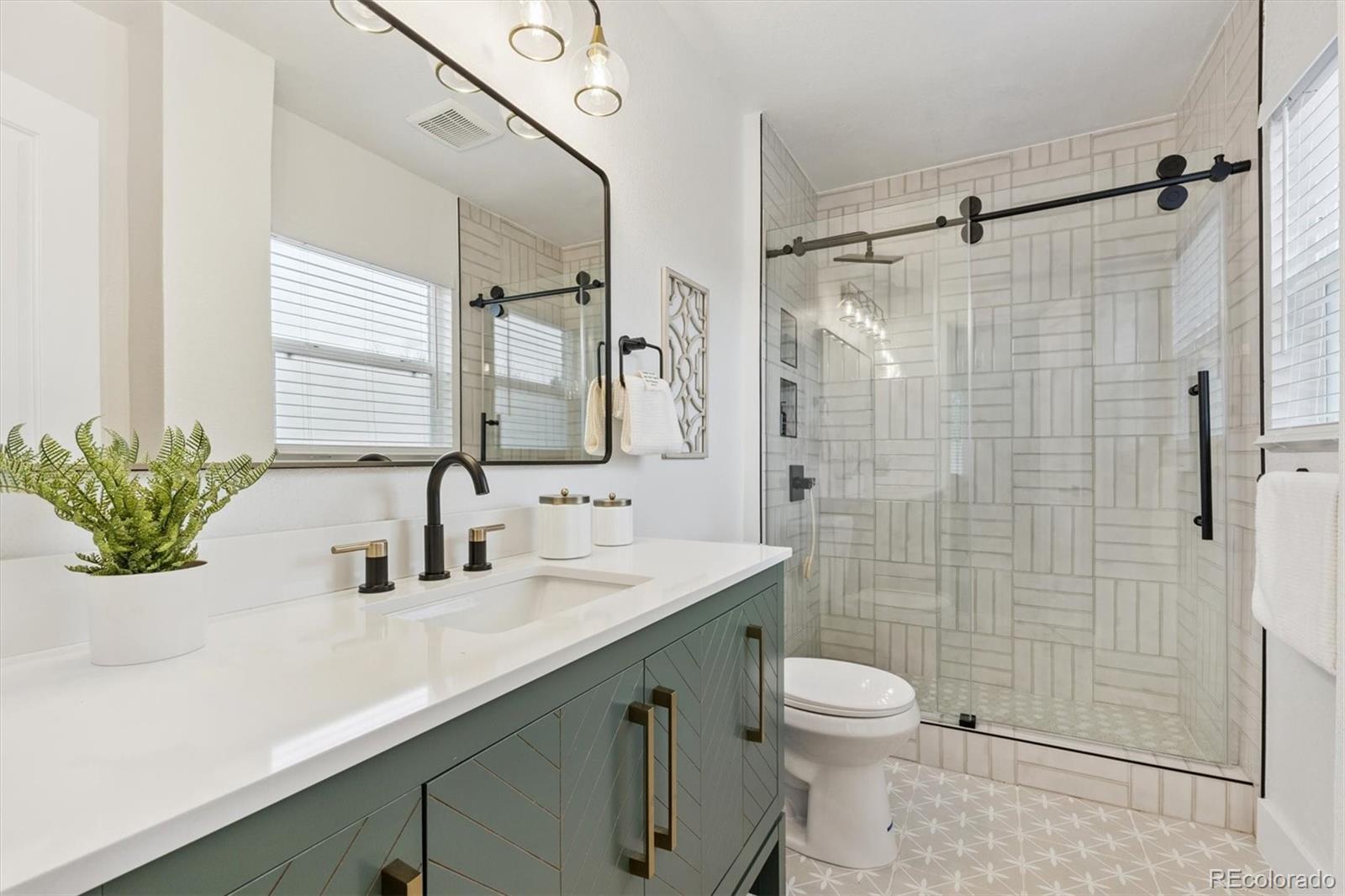 3360 Broadway Boulder, CO 80304 - Photo 10 of 35 a bathroom with a sink a toilet and shower
