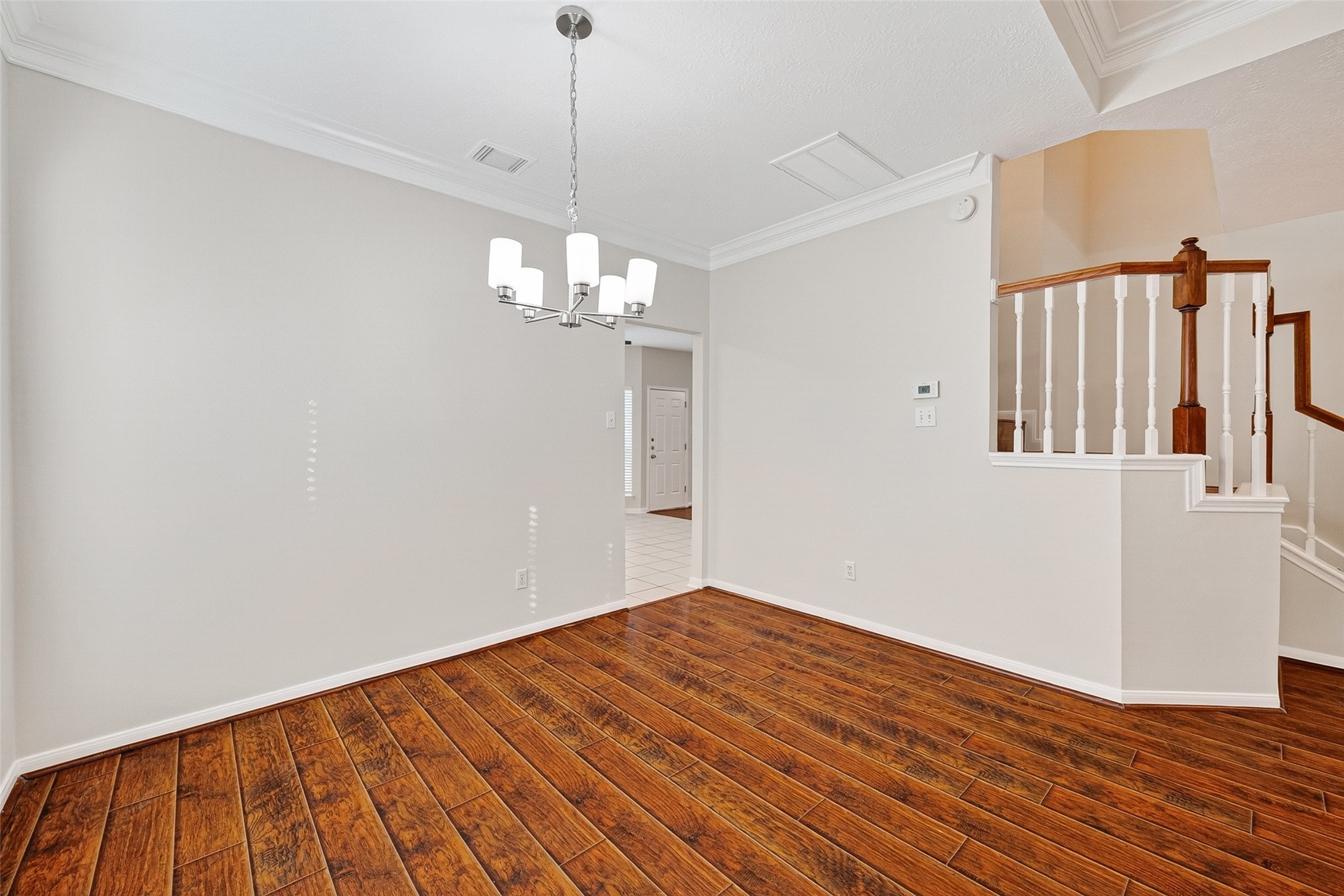 4539 Springfield Lakes Street Sugar Land, TX 77479 - Photo 6 of 34 a view of a livingroom with wooden floor and staircase