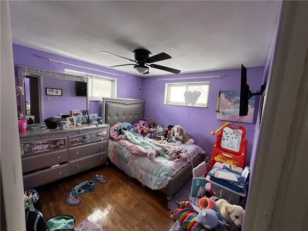 a bed room with a bed furniture and a window