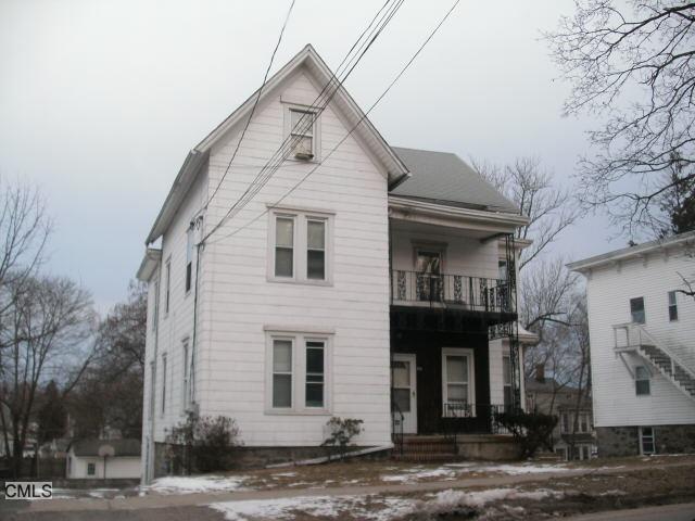 33 Division Street Danbury, CT 06810 - Photo 1 of 1 a view of a white house with large windows