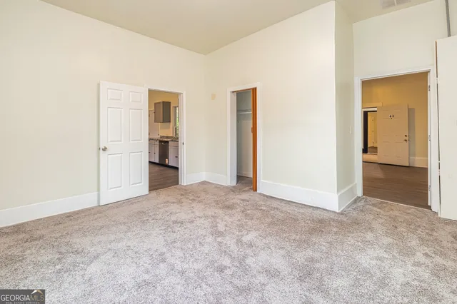 a kitchen with granite countertop a stove and cabinets