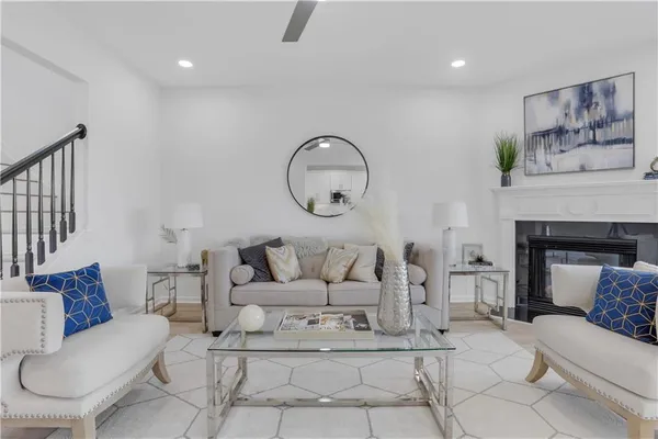 a living room with furniture a couch and a fireplace