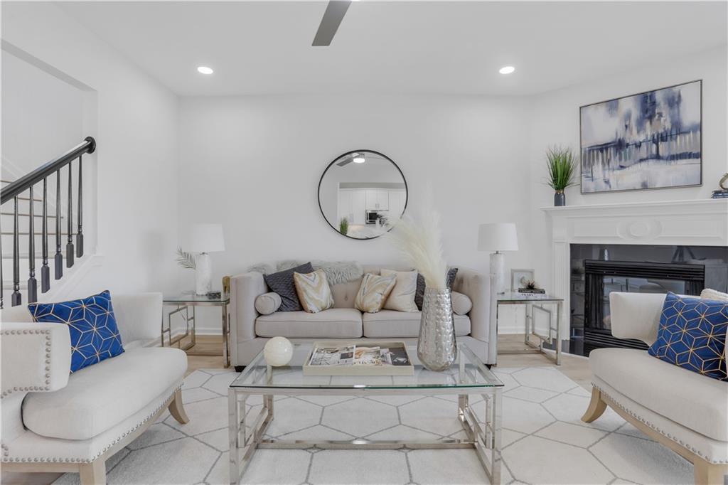 a living room with furniture a couch and a fireplace