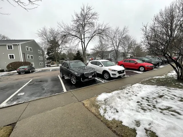 a couple of cars parked in front of a house