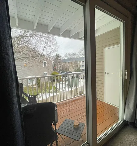 a view of a porch with a furniture