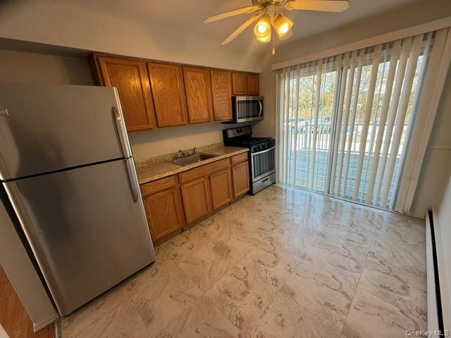 54 Ralph Avenue Babylon, NY 11702 - Photo 3 of 6 a kitchen with granite countertop a refrigerator a sink a stove a microwave and island