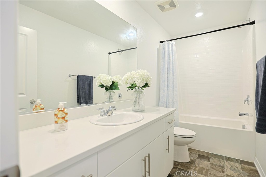 7486 Olive Grv Street Riverside, CA 92507 - Photo 39 of 57 a bathroom with a sink toilet and shower