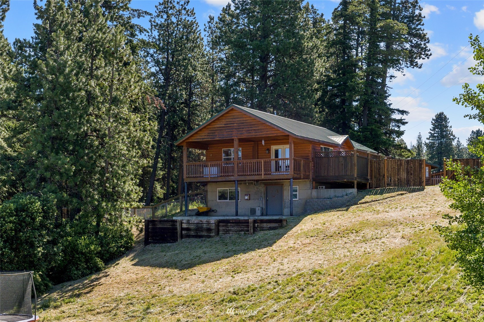 a front view of a house with a yard and pathway