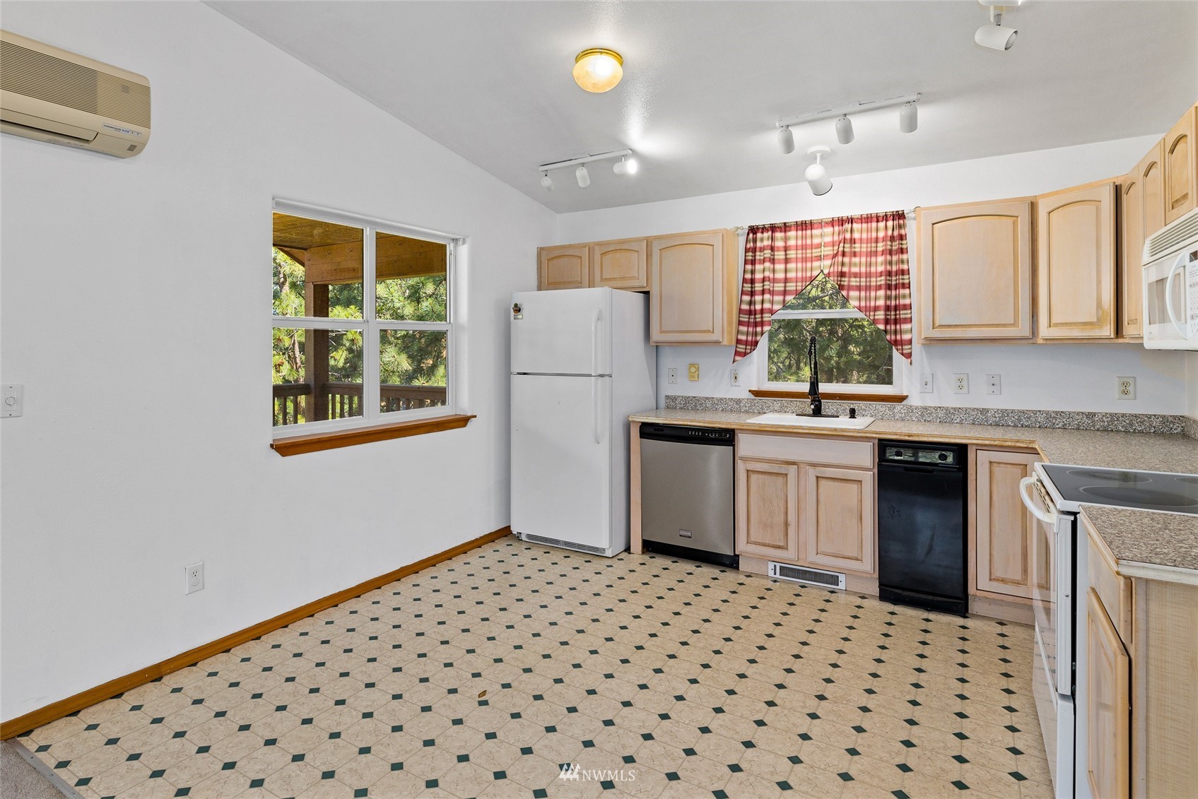 5741 Upper Peoh Point Road Cle Elum, WA 98922 - Photo 17 of 39 a kitchen with a sink a stove cabinets and window