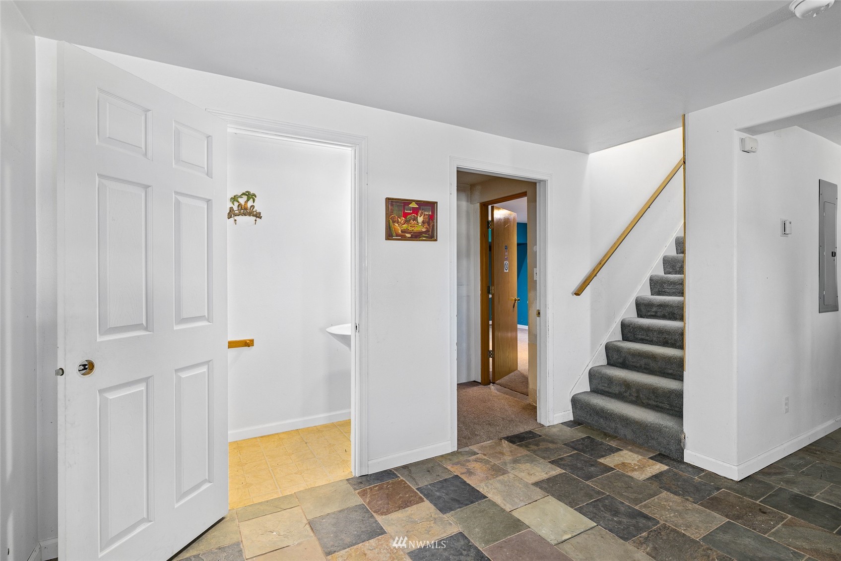 5741 Upper Peoh Point Road Cle Elum, WA 98922 - Photo 26 of 39 a view of a hallway with entryway and stairs