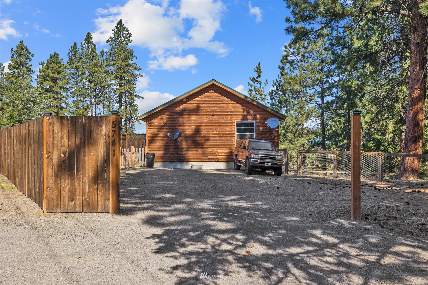 5741 Upper Peoh Point Road Cle Elum, WA 98922 - Photo 3 of 39 a front view of a house with a yard