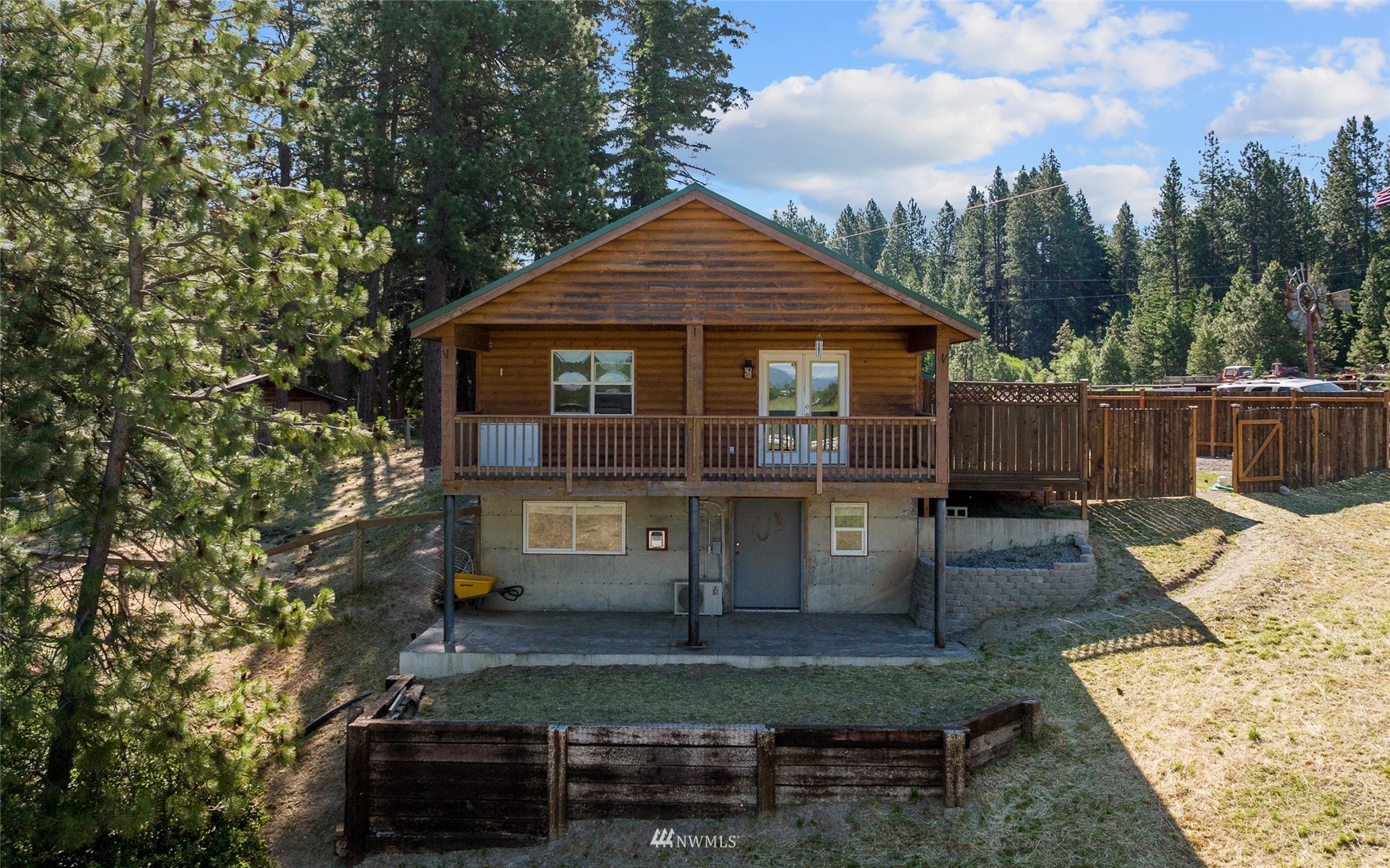 5741 Upper Peoh Point Road Cle Elum, WA 98922 - Photo 39 of 39 a front view of a house with a yard