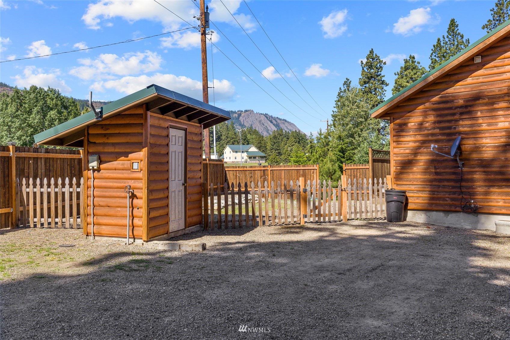 5741 Upper Peoh Point Road Cle Elum, WA 98922 - Photo 5 of 39 a front view of a house with a fence