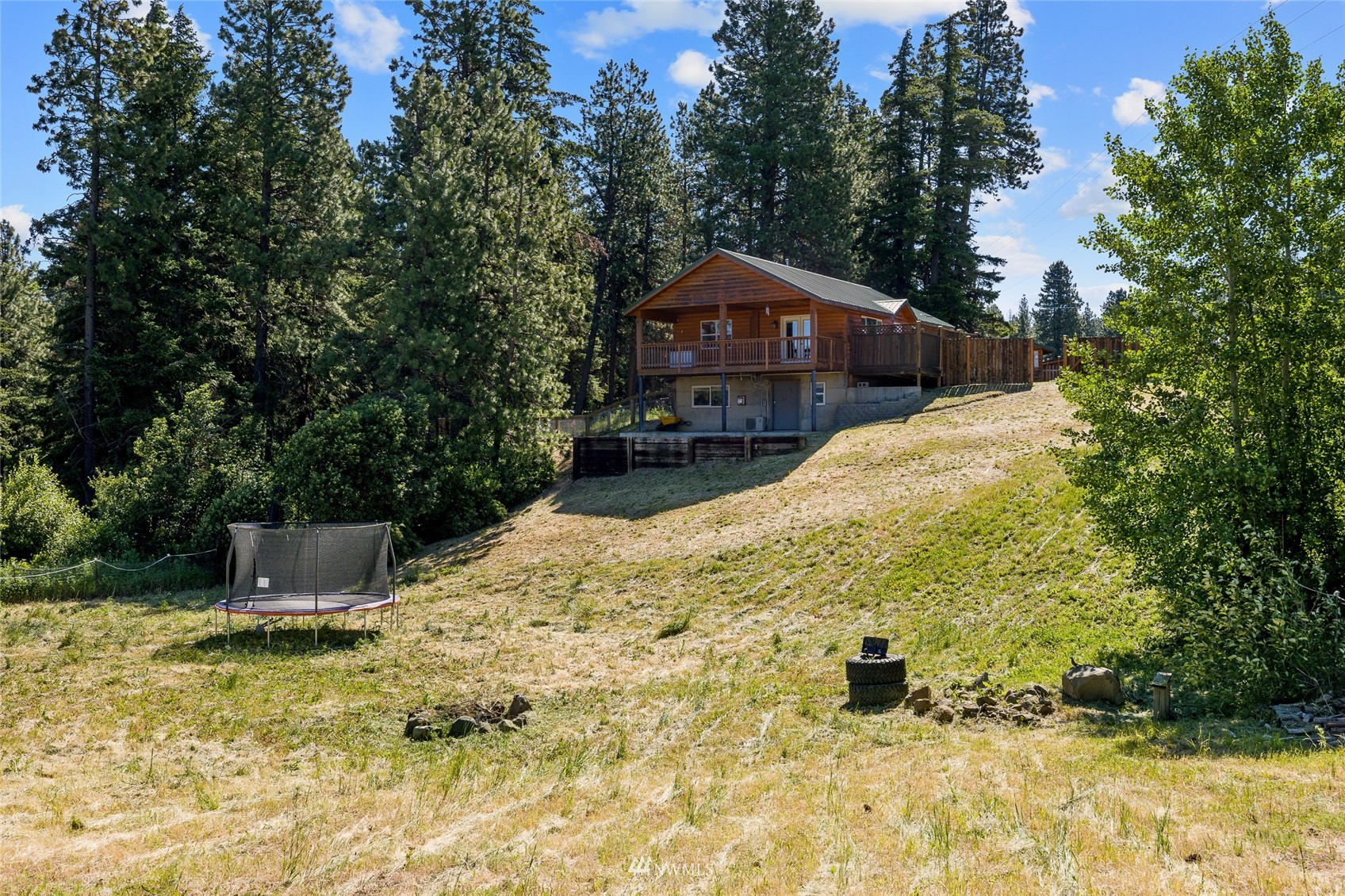 5741 Upper Peoh Point Road Cle Elum, WA 98922 - Photo 9 of 39 a front view of a house with a yard