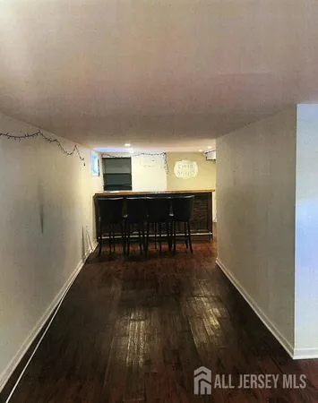 a view of dining room and kitchen with wooden floor