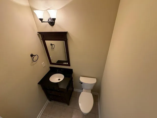 a bathroom with a toilet and a sink