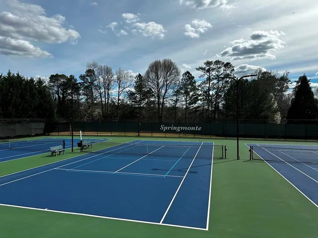a view of a patio with a table and chairs