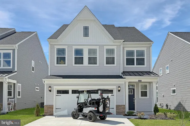 a view of a building with a car park front of a house