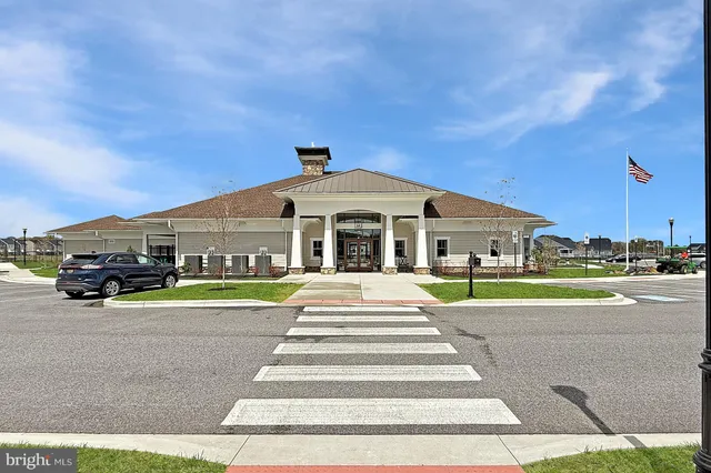 a view of a dining hall with furniture and wooden floor