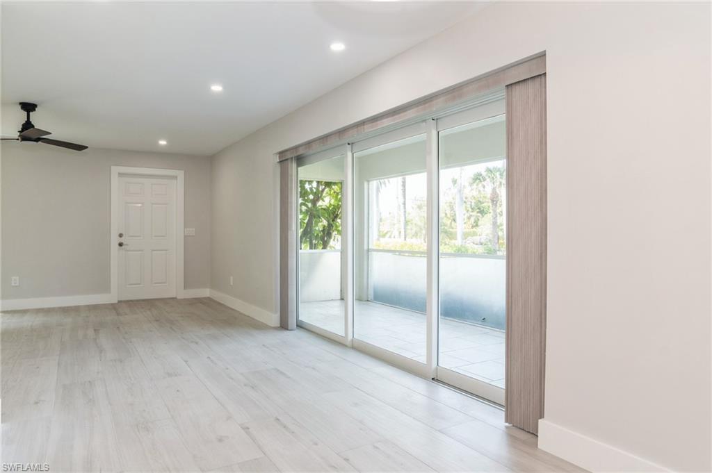 1155 Sandpiper Street, Unit B3 Naples, FL 34102 - Photo 7 of 21 Spare room with light wood-style flooring, ceiling fan, and recessed lighting