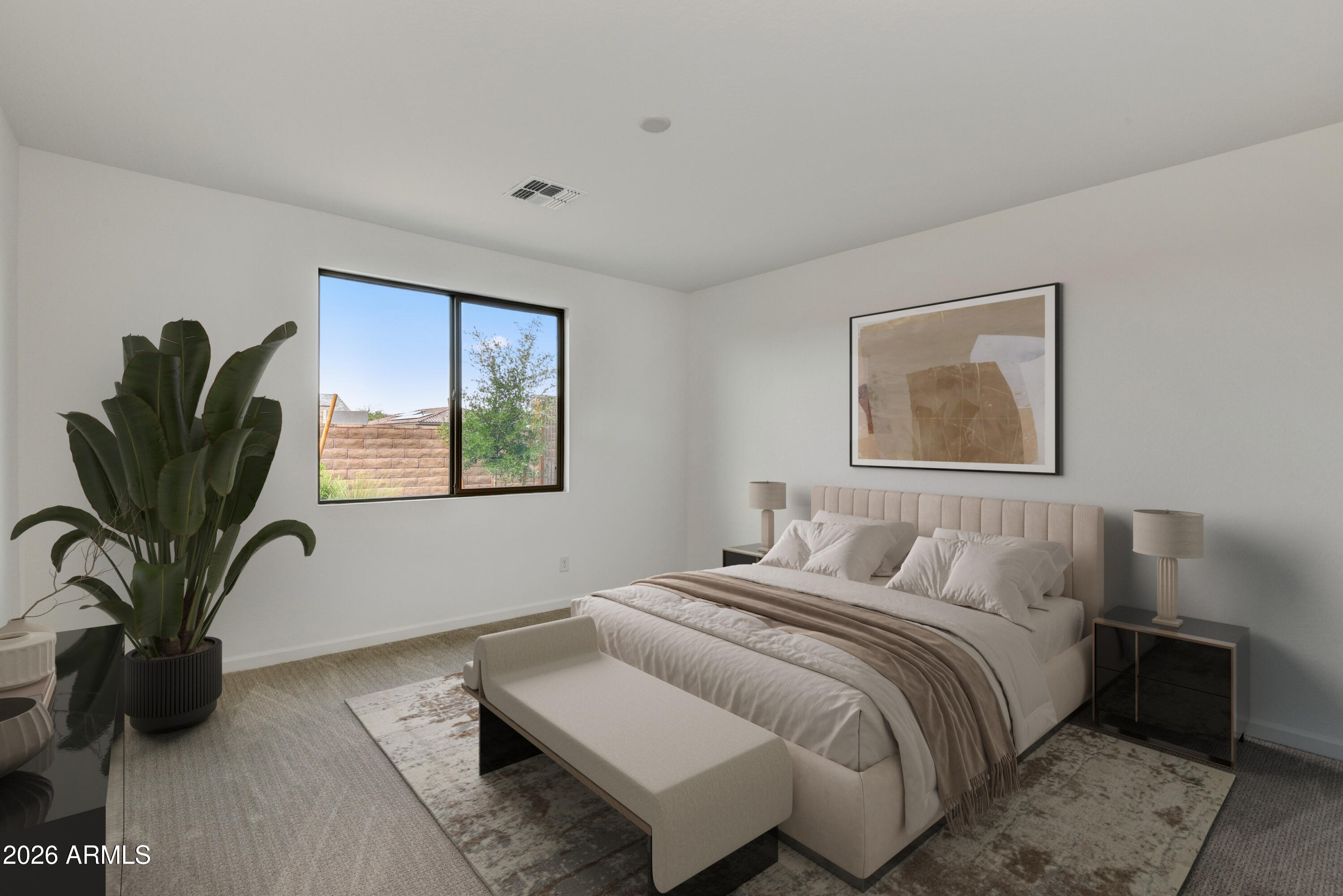 4522 Jackpot Road Wickenburg, AZ 85390 - Photo 12 of 22 a bedroom with a bed and a painting on the wall
