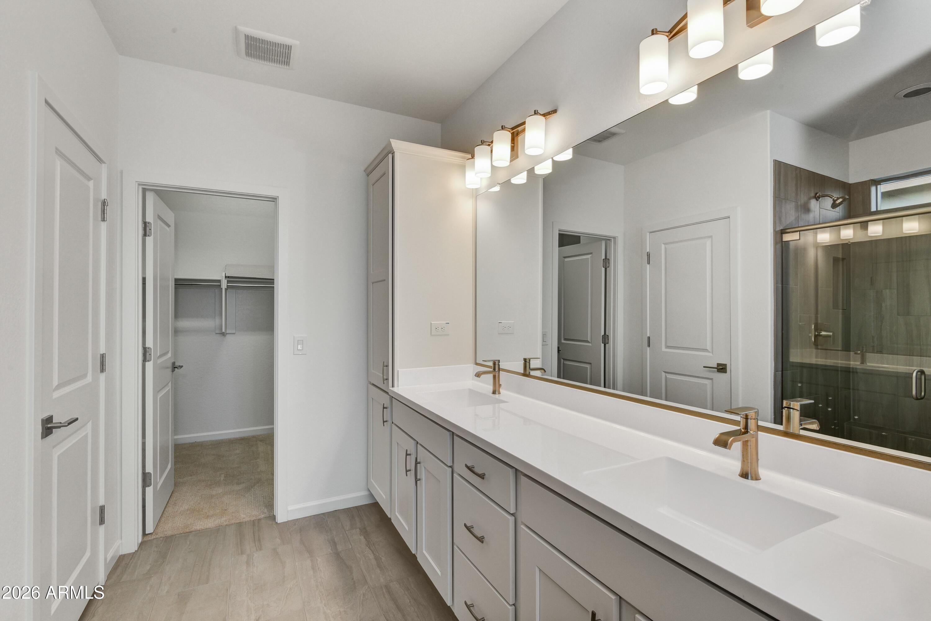 4522 Jackpot Road Wickenburg, AZ 85390 - Photo 14 of 22 a bathroom with a double vanity sink mirror and double