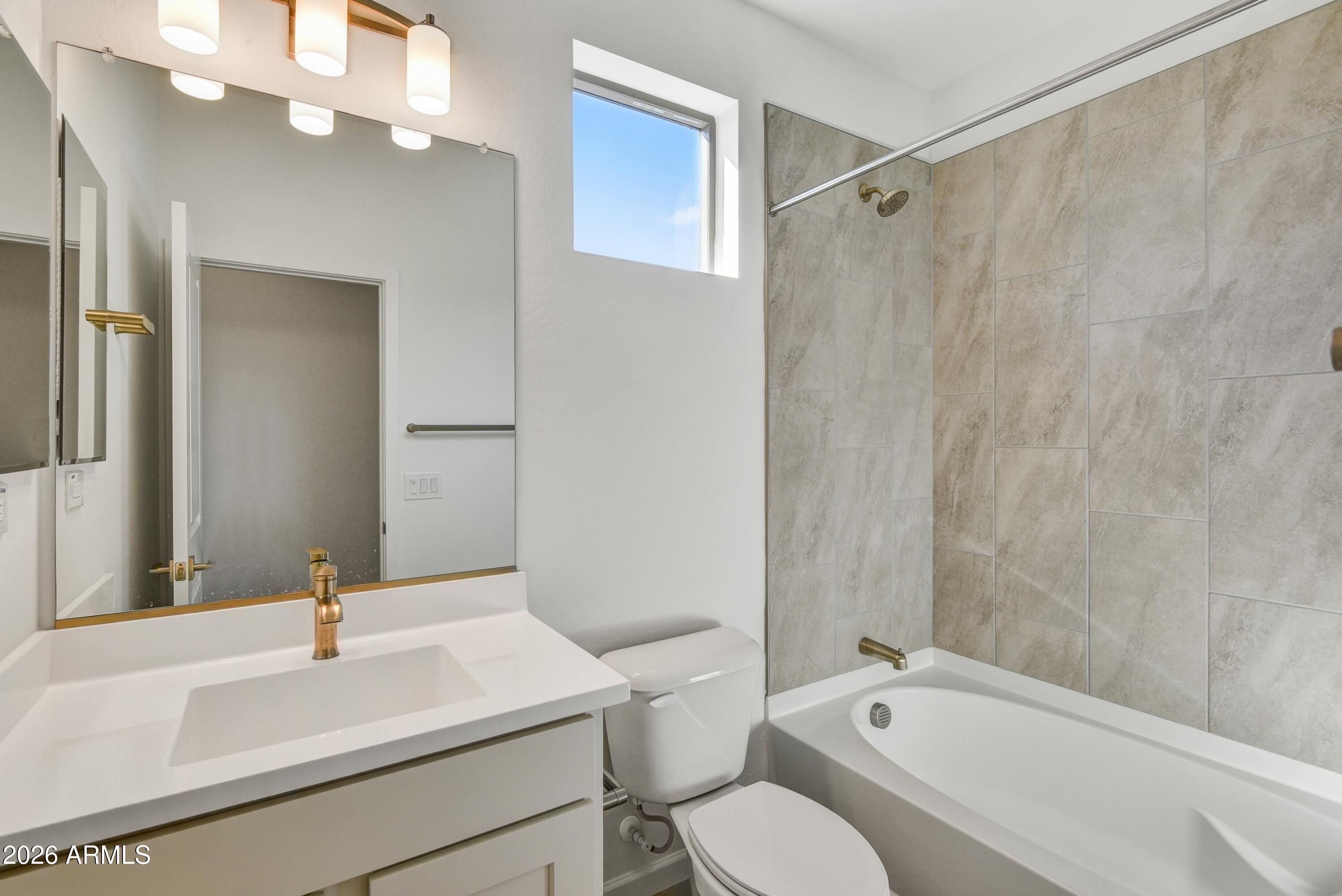 4522 Jackpot Road Wickenburg, AZ 85390 - Photo 19 of 22 a bathroom with a sink a toilet and shower