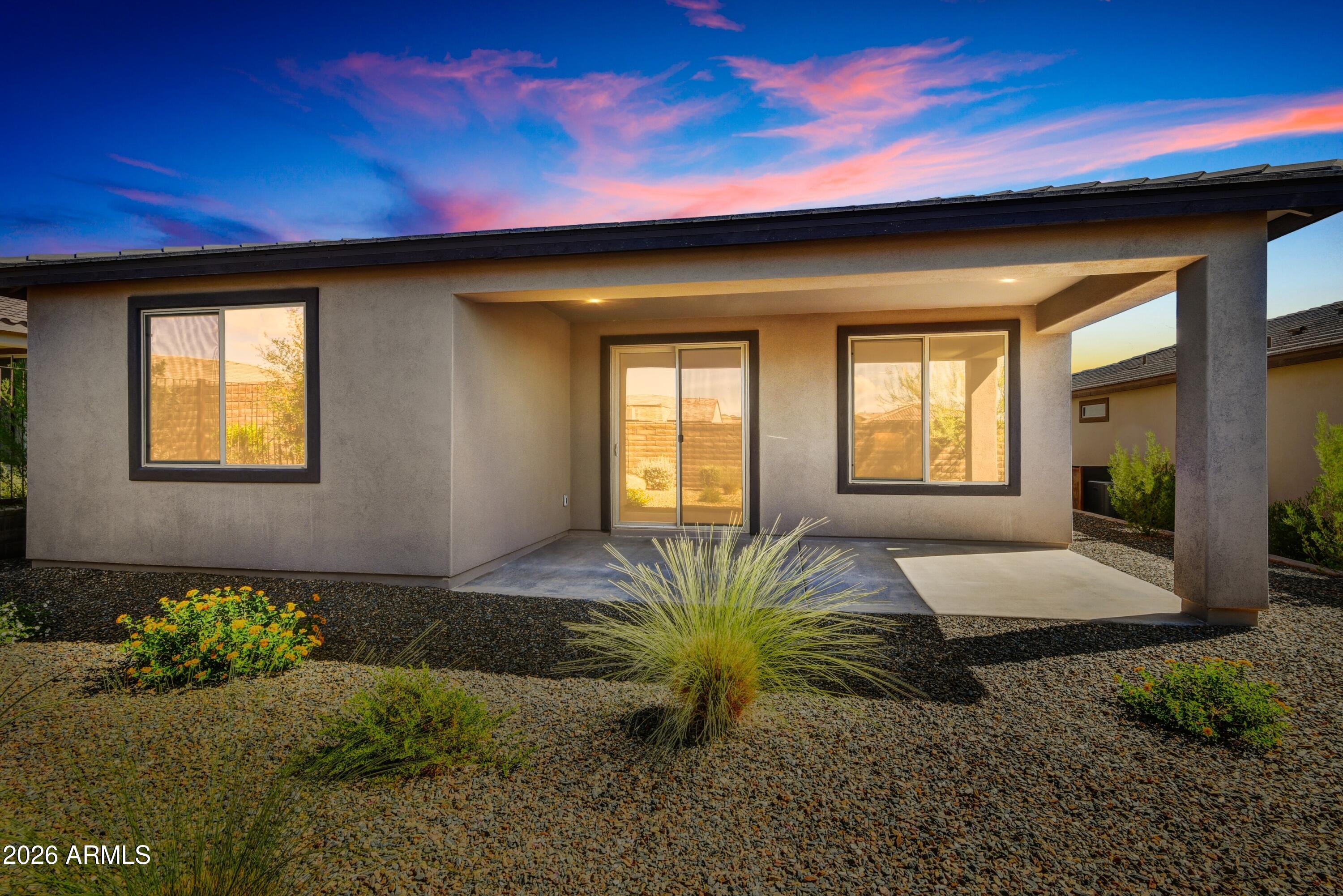 4522 Jackpot Road Wickenburg, AZ 85390 - Photo 22 of 22 a house with a garden in the background