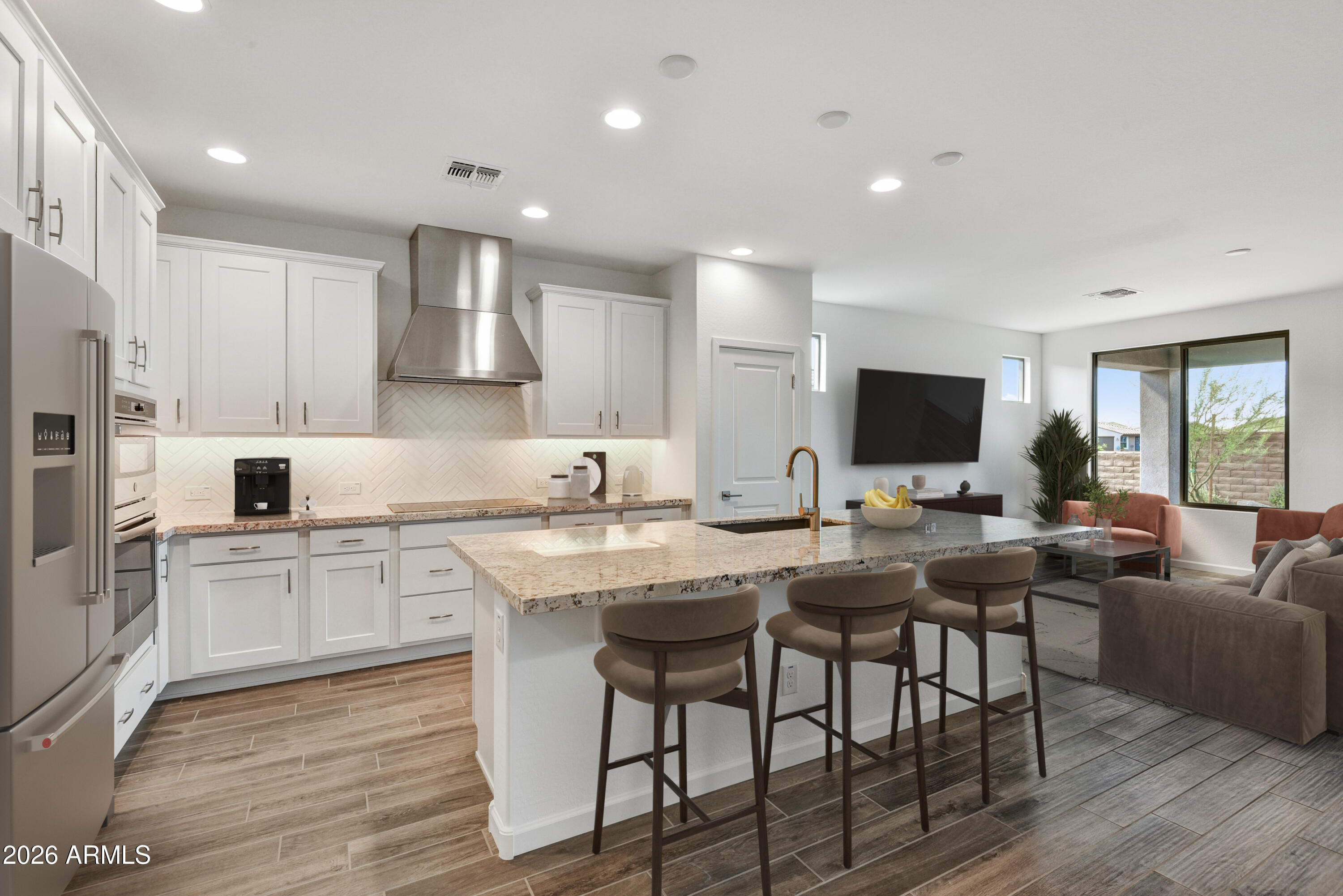 4522 Jackpot Road Wickenburg, AZ 85390 - Photo 5 of 22 a kitchen with appliances cabinets and chair