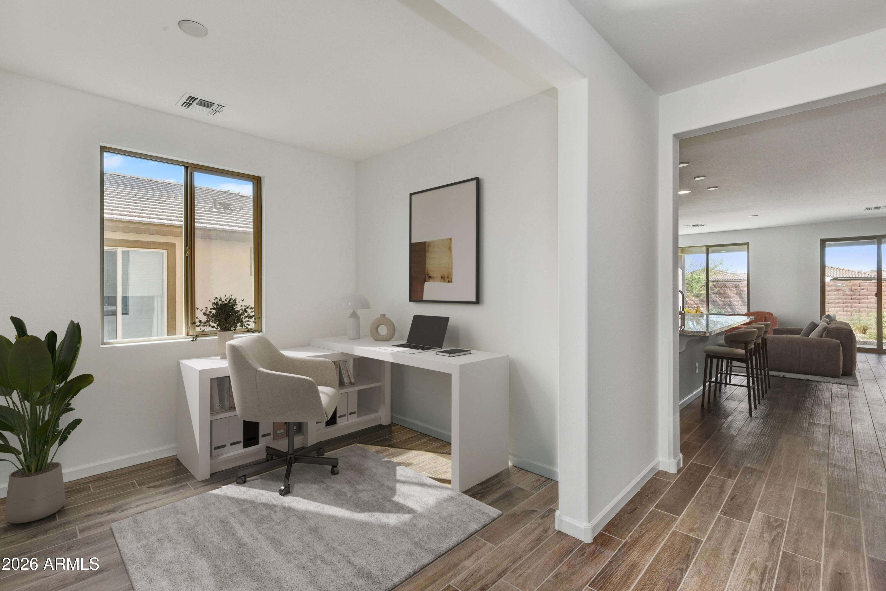 4522 Jackpot Road Wickenburg, AZ 85390 - Photo 10 of 22 a view of a livingroom with workspace and a window