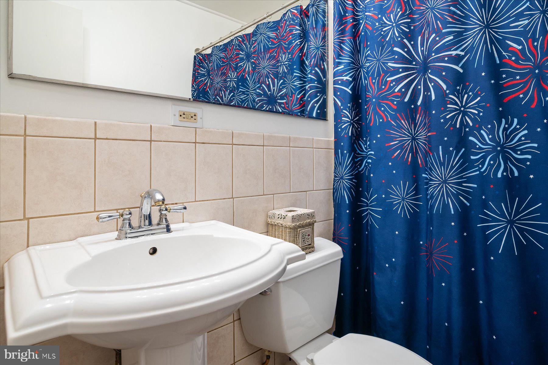 19 Old Tollgate Road Owings Mills, MD 21117 - Photo 16 of 37 a bathroom with a toilet and sink